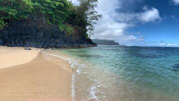 On the beach, sun loungers, beach towels