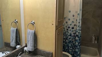 Combined shower/tub, hair dryer, towels, soap