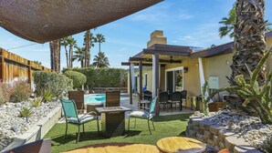 A backyard with a pool, outdoor seating, and a pergola. - Tranquil Padua Pad - A Ryson Property (Palm Springs)