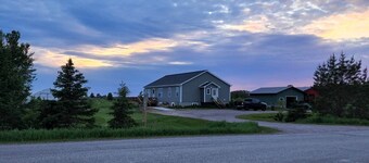 Country, close to town, sled trails, skiing, large snowmobile boat trailer space