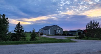 Country, close to town, sled trails, skiing, large snowmobile boat trailer space