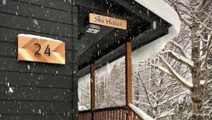 A wooden building with a sign reading "Ski Haus" and a number "24" indicating the room number. - Cozy Manchester Getaway with Amazing Views!!! (Winhall)