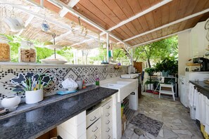 Fridge, stovetop, cookware/dishes/utensils, dining tables
