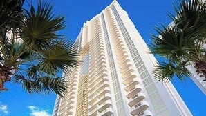 A tall, modern hotel with multiple balconies and a clear blue sky in the background. -  Strip View/ MGM Signature Studio ★ No resort fees (Las Vegas)