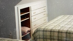 A bedroom with a bed, a wardrobe, and a window. - Lodging Near Public Transportation (Acton)