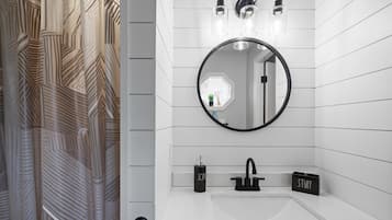 Bathtub, hair dryer, towels, soap