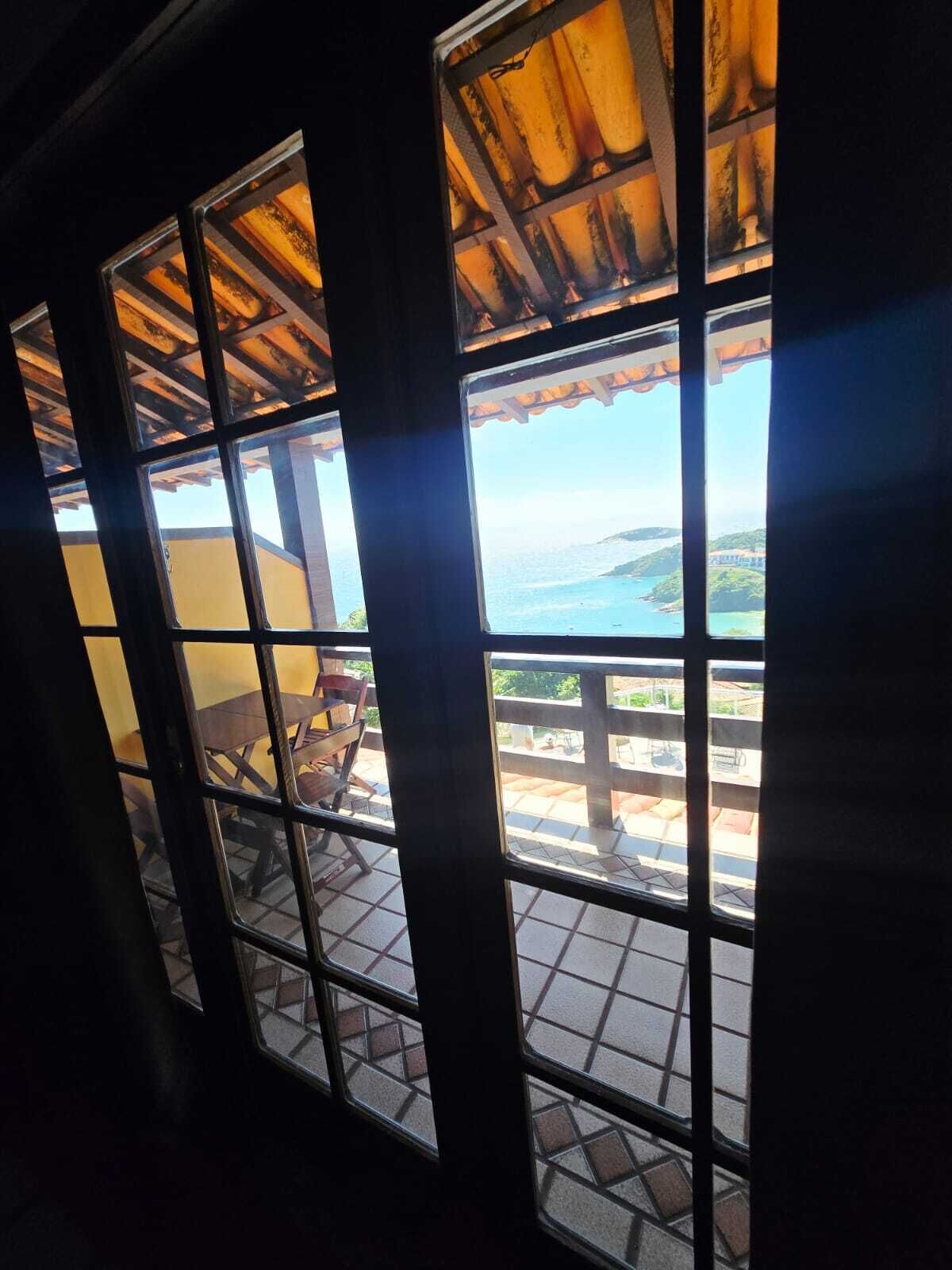 A room with large windows overlooking a scenic view.