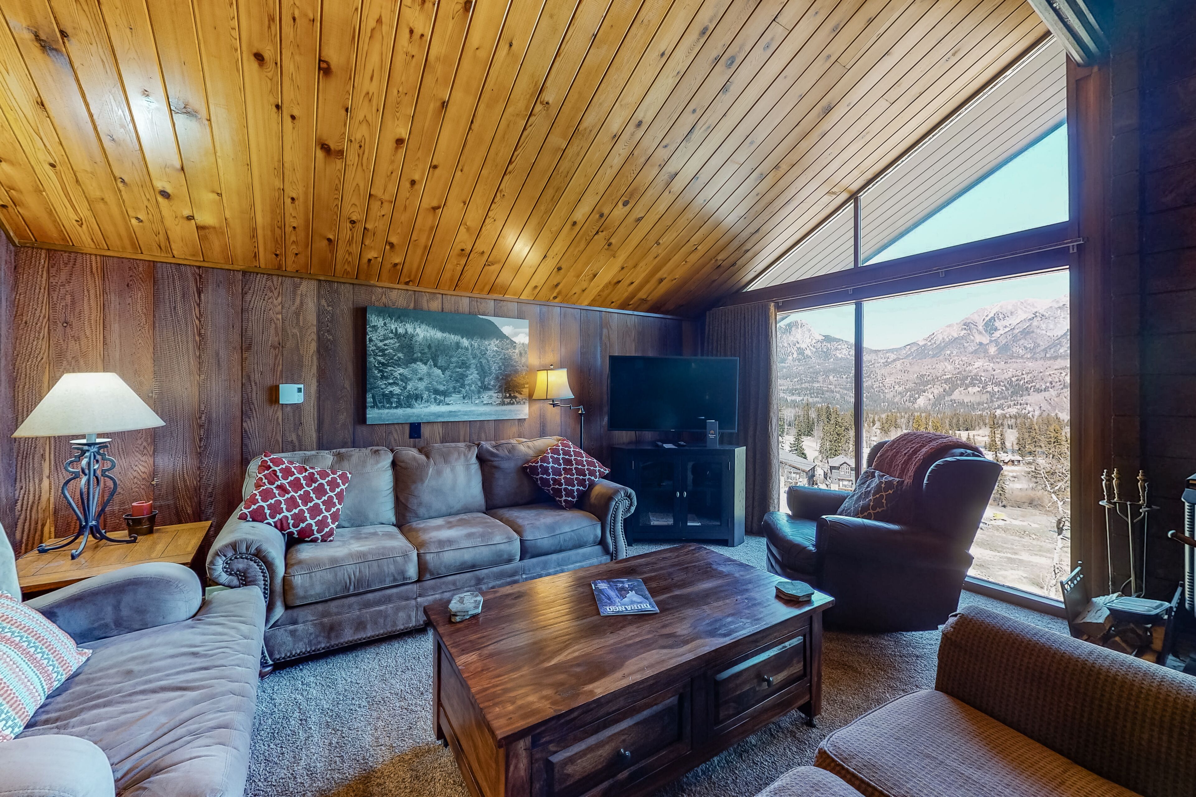 Ski-in/ski-out condo with lake and mountain views, woodstove