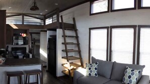 Living area - Family friendly cabin near resort private lake, pool and lazy river. (Savannah)