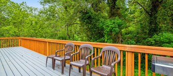 Beautiful home with large deck, gas grill, nestled around the trees