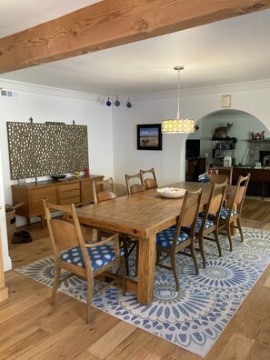 Enjoy meals in this stylish dining area with a wooden table and six comfortable chairs.