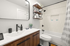 Combined shower/tub, hair dryer, towels, soap