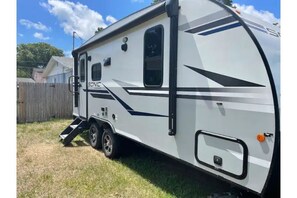 Enjoy easy access to this RV with a convenient ramp and spacious interior.