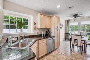 Fridge, microwave, oven, stovetop - Charming two-story , three bedroom, home five minutes from the Gulf Coast! (Panama City Beach)