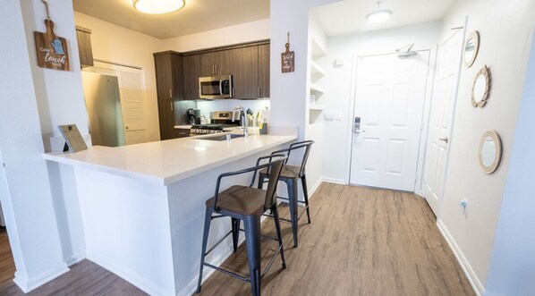 Microwave, coffee/tea maker, cookware/dishes/utensils