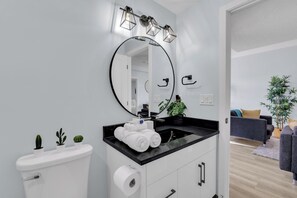 Combined shower/tub, hair dryer, towels, soap