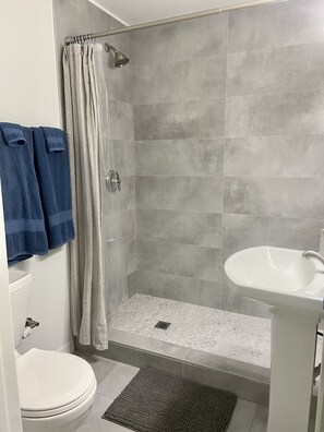 Combined shower/bathtub