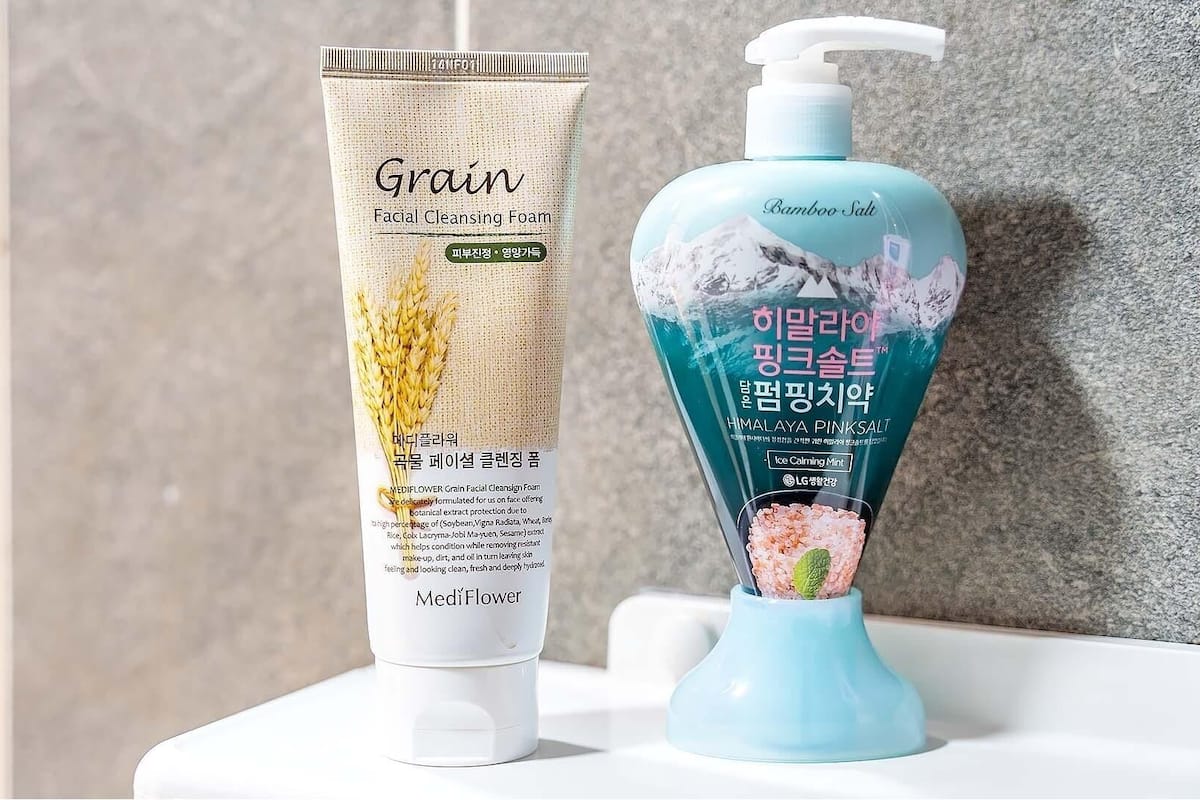 Two skincare products on a bathroom counter.
