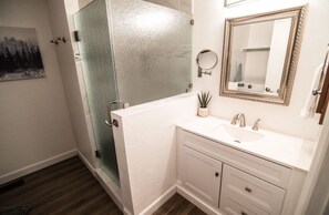 Shower, hair dryer, towels, soap