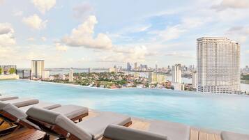 Outdoor pool, open 7:00 AM to 11:00 PM, sun loungers