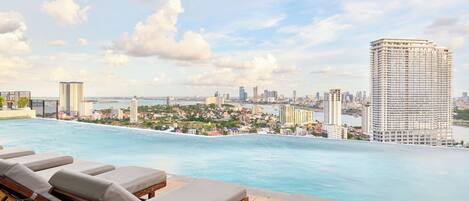 Outdoor pool, open 7:00 AM to 11:00 PM, sun loungers