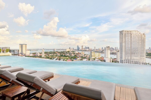 Outdoor pool, open 7:00 AM to 11:00 PM, sun loungers