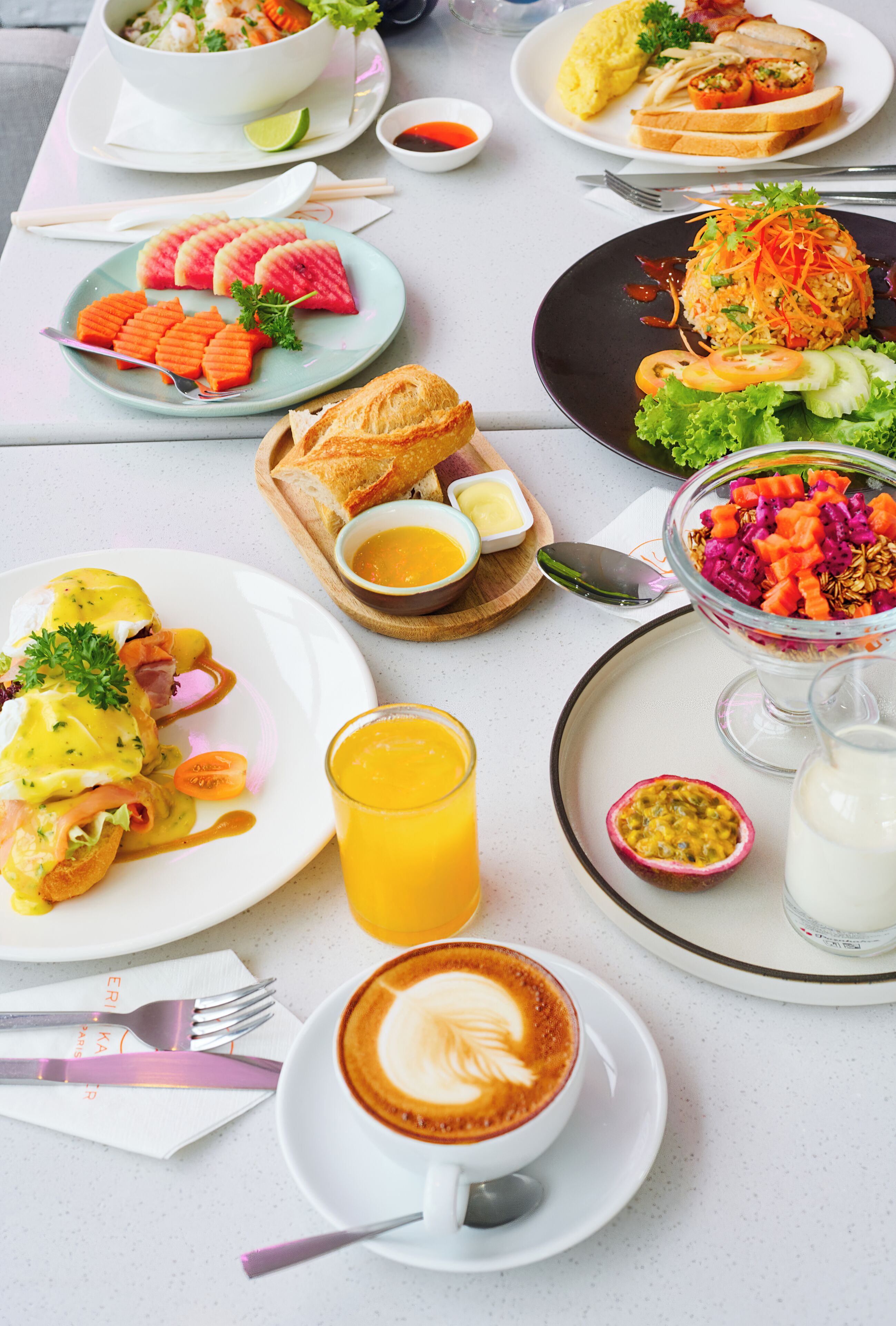 A breakfast table with various dishes, including eggs, toast, and a coffee cup.