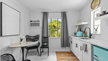 Fridge, microwave, stovetop, coffee/tea maker