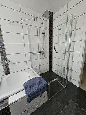 Bathtub, hair dryer, towels, soap