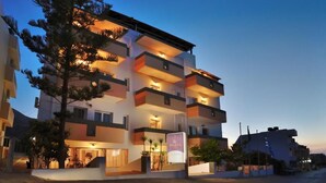 A multi-story hotel with balconies and a sign reading "Selina." - Selena View Hotel & Apartments (Hersonissos)