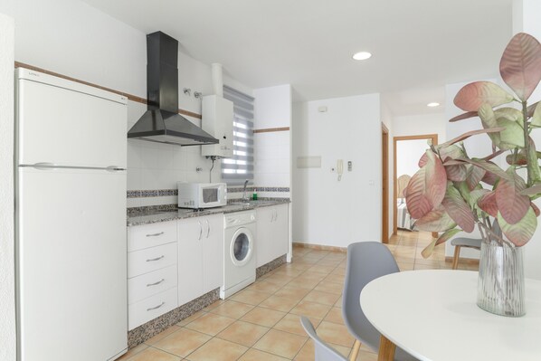 Fridge, microwave, stovetop, coffee/tea maker