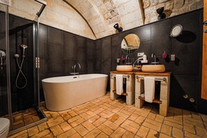 Separate tub and shower, rainfall showerhead, designer toiletries