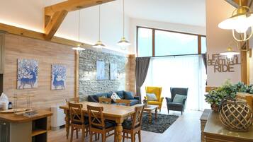 Deluxe Chalet, 3 Bedrooms, Sauna, Mountain View | Living area | 100-cm TV with satellite channels, fireplace