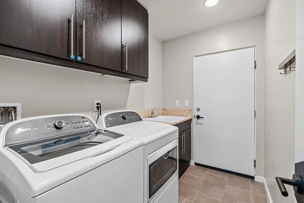 Convenient in-home laundry room with washer and dryer
