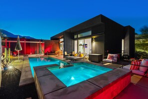 Evening poolside atmosphere with illuminated contemporary architecture