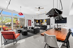 Open-concept dining and living area with views of the outdoor lounge