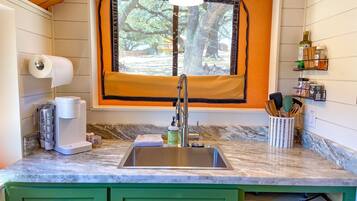 Microwave, coffee/tea maker, toaster, cookware/dishes/utensils