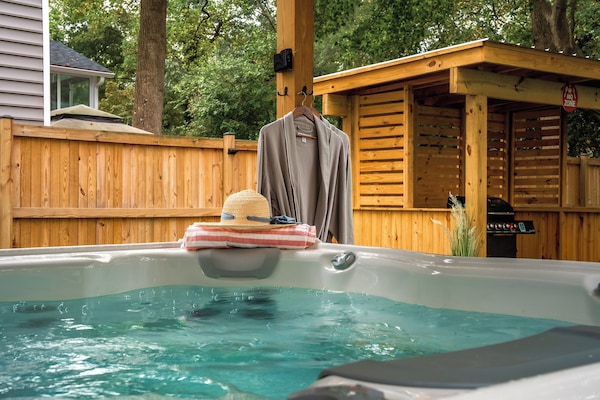 Grab your robes and let your stress melt away with a dip in the hot tub!