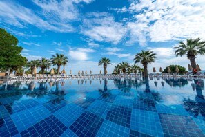 Seasonal outdoor pool, pool umbrellas, pool loungers