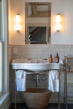 Bathtub, hair dryer, towels, soap
