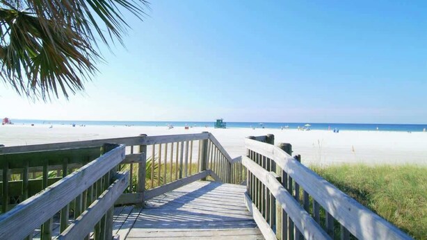 A wooden boardwalk leading to a beach with clear skies. - Pool home,Pet friendly, 5 mins drive to Siesta Key (Sarasota)