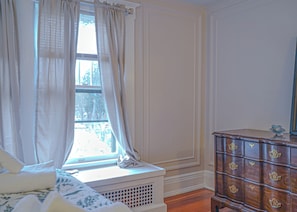 1 bedroom, desk, iron/ironing board, travel crib