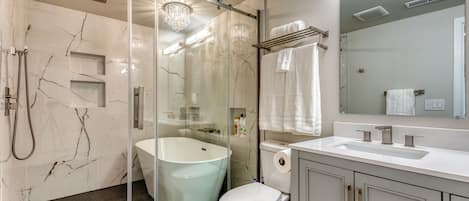 Combined shower/bathtub, hair dryer, towels, soap