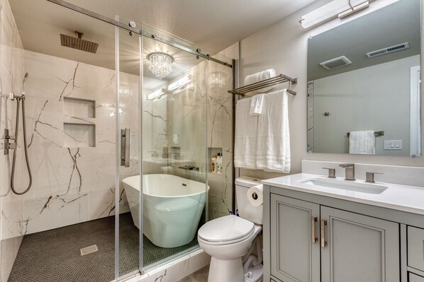 Combined shower/tub, hair dryer, towels, soap