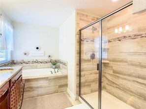 Combined shower/tub, hair dryer, towels, soap