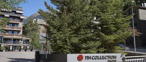 A building with a sign reading "Collection Hotel."