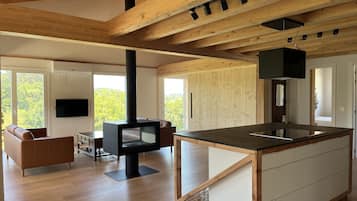 Deluxe Apartment, 3 Bedrooms, Terrace, Pool View | Living area | 50-inch Smart TV with digital channels, TV