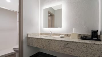 Combined shower/tub, towels, soap, shampoo