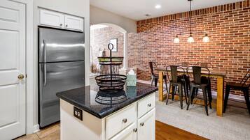 Microwave, dishwasher, coffee/tea maker, cookware/dishes/utensils