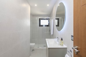 Shower, hair dryer, towels, soap